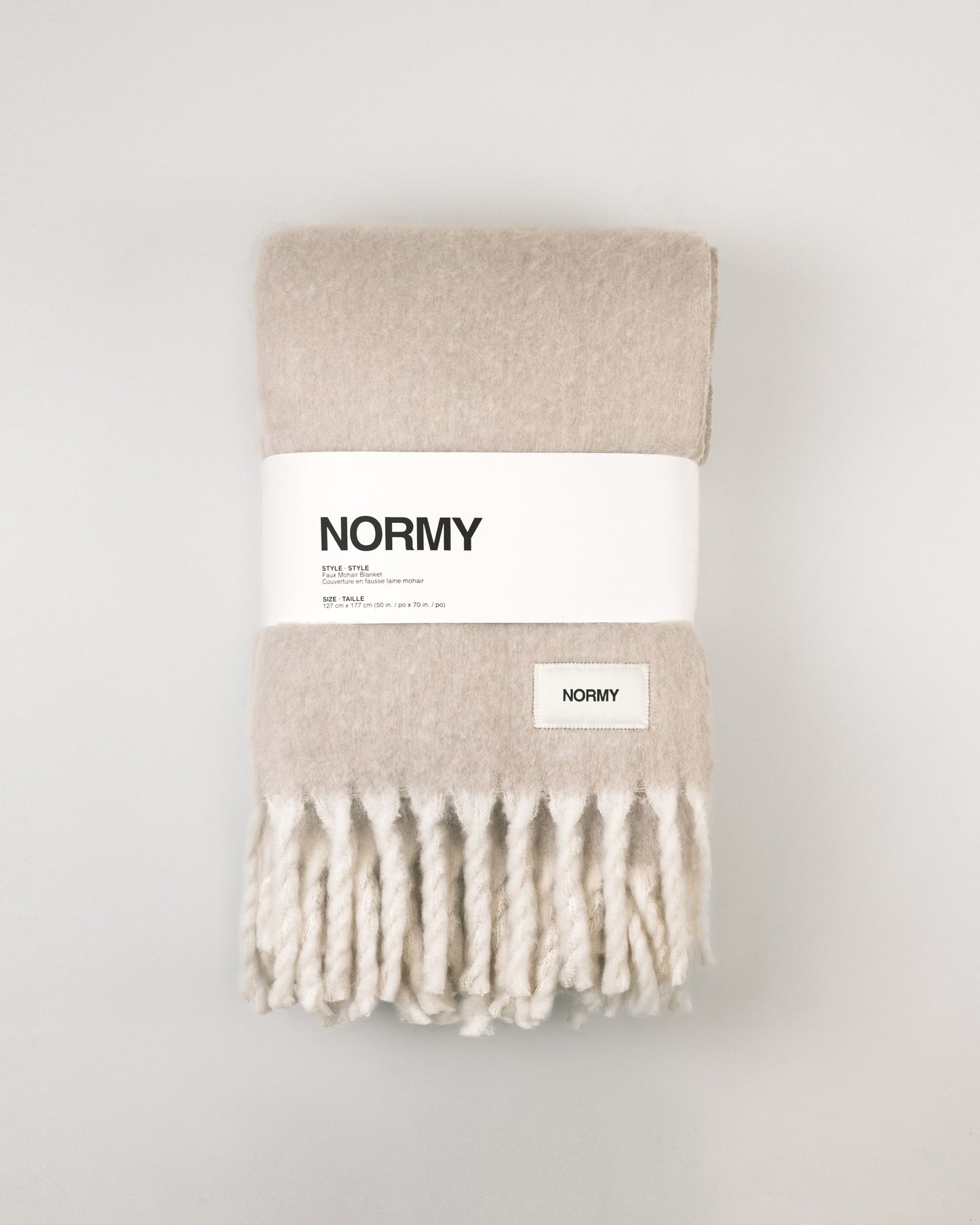 Faux Mohair Blanket in Clay/Moon packaged in Normy packaging