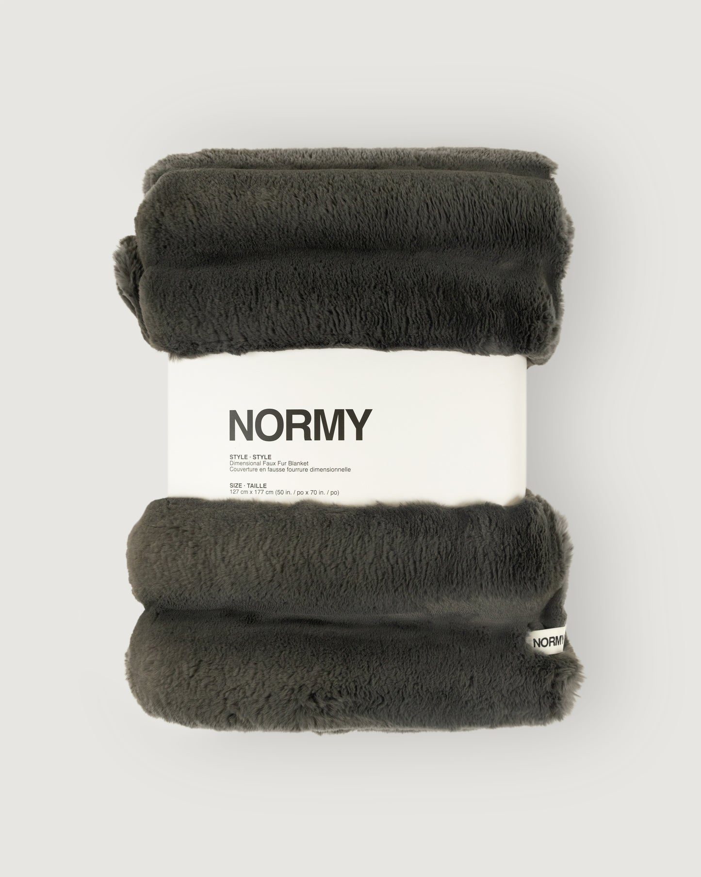Dimensional faux fur blanket in peak packaged in Normy packaging