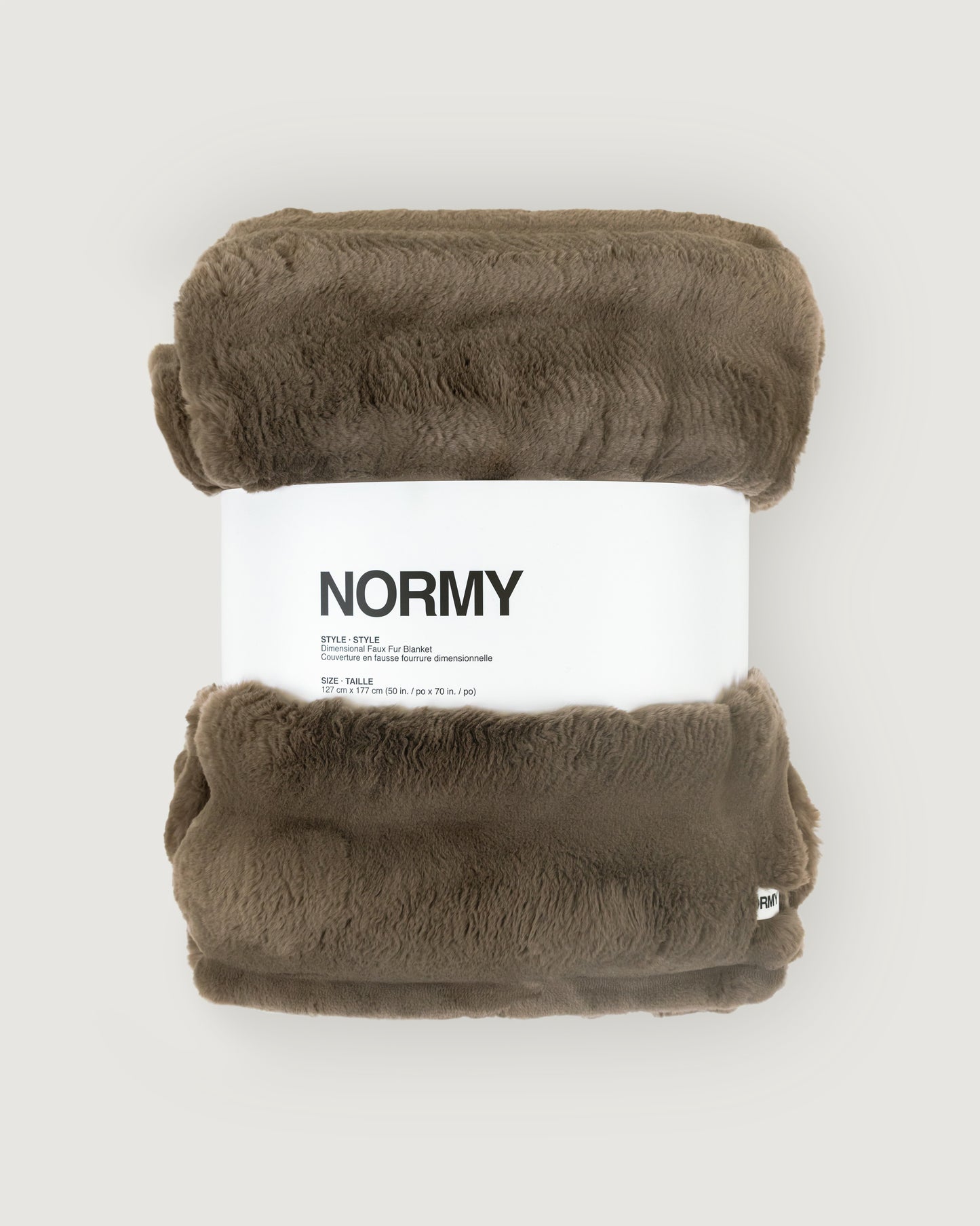 Dimensional faux fur blanket in fungi packaged in Normy packaging