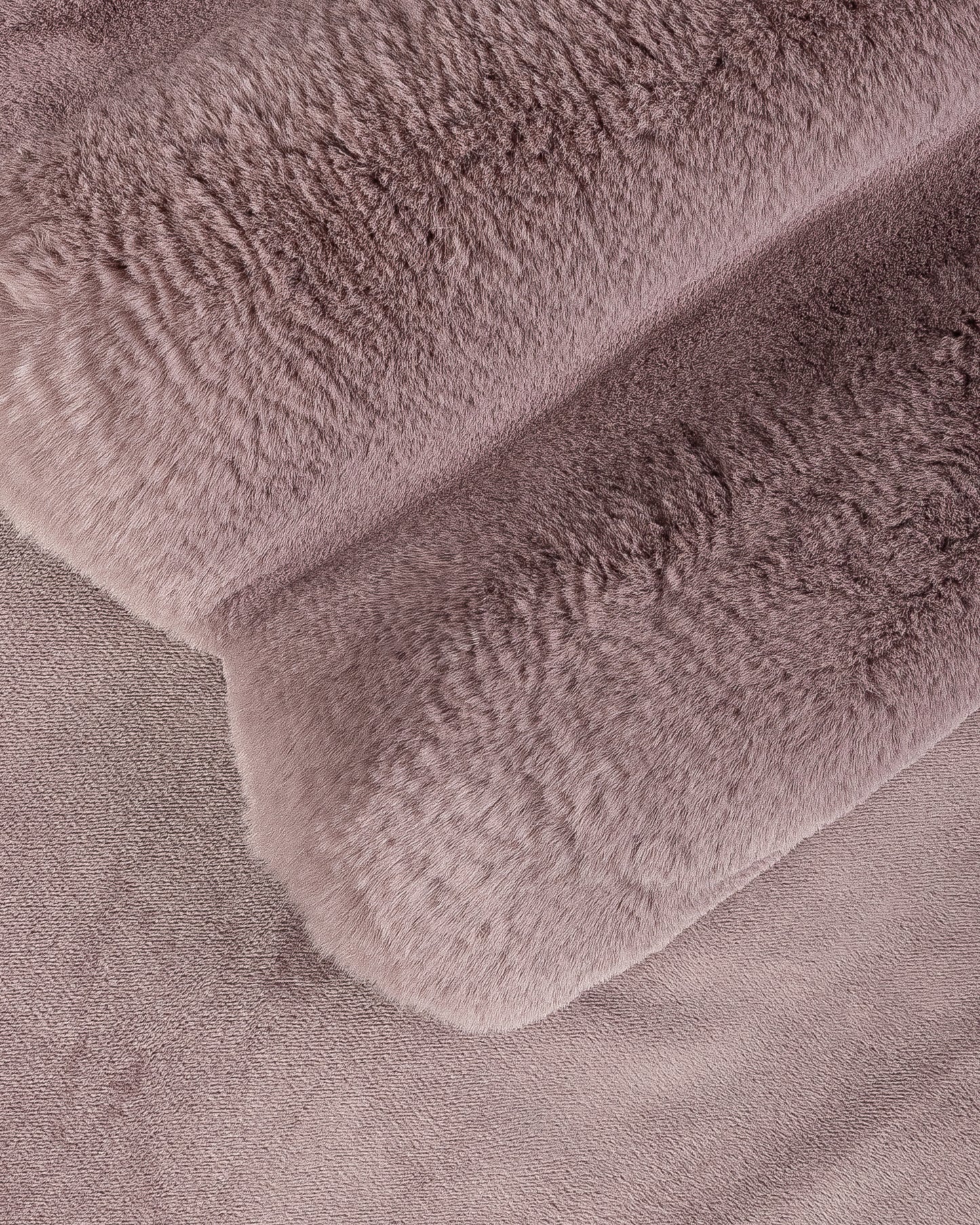 close up fabric shot of a dimensional faux fur blanket in lilac
