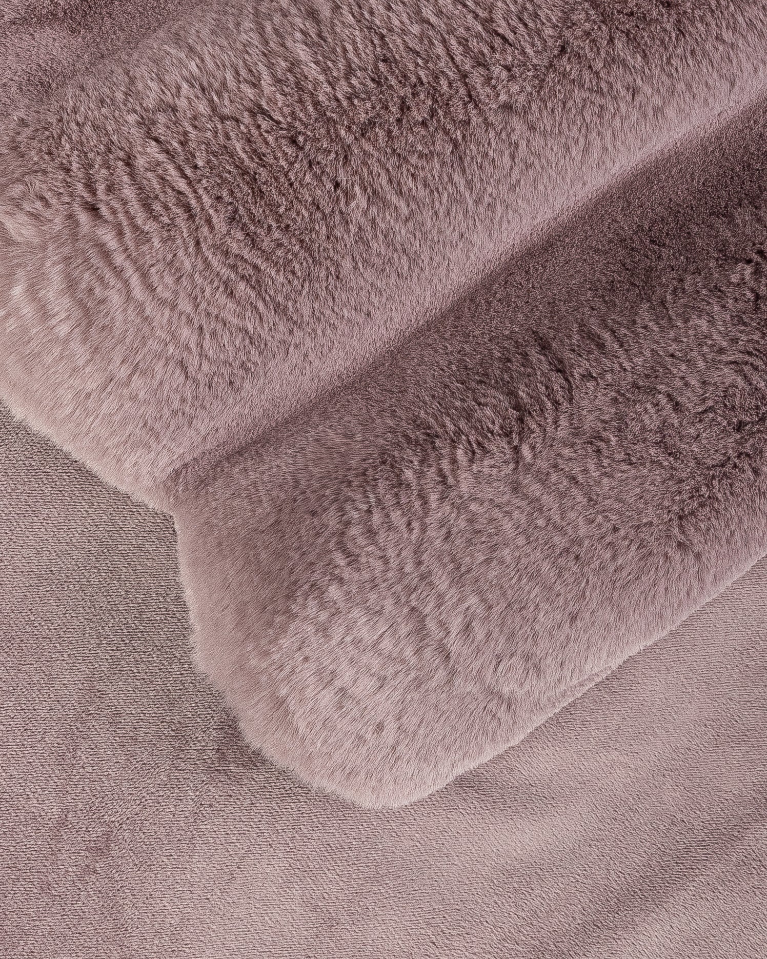 close up fabric shot of a dimensional faux fur blanket in lilac
