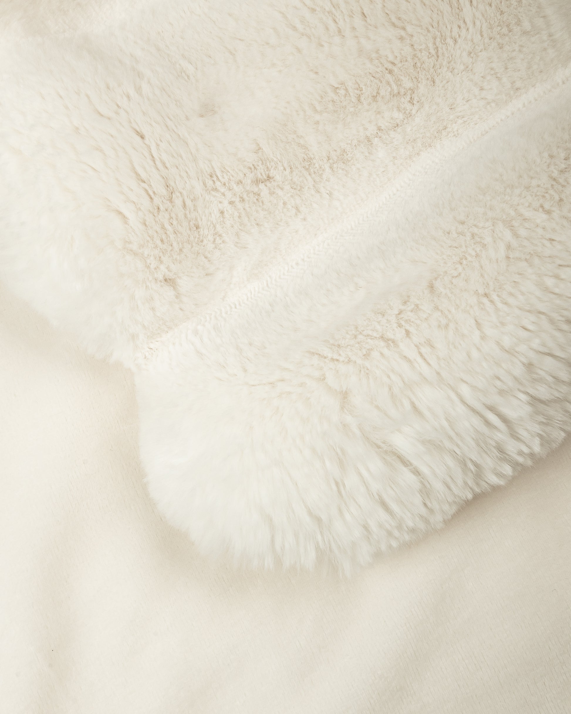 close up fabric shot of a dimensional faux fur blanket in moon