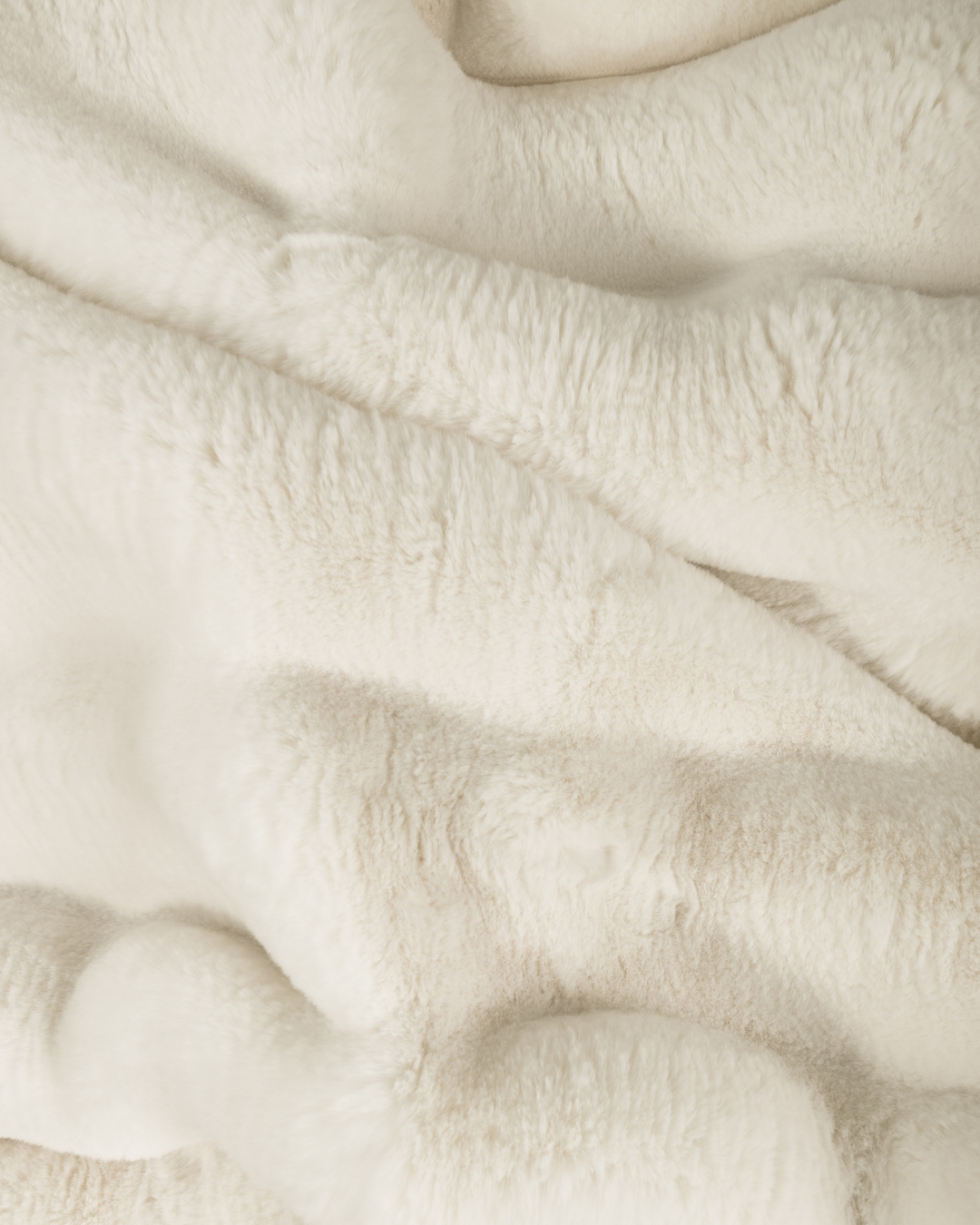 close up fabric shot of a dimensional faux fur blanket in moon