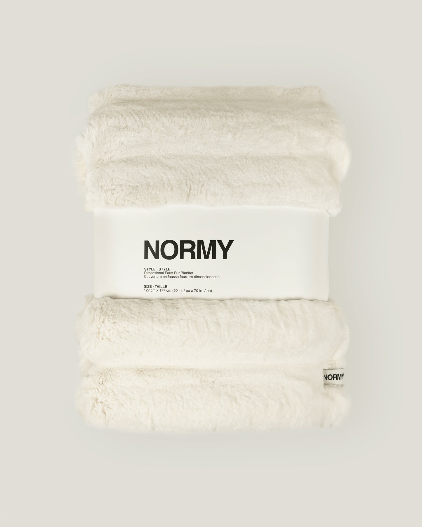 Dimensional faux fur blanket in moon packaged in Normy packaging