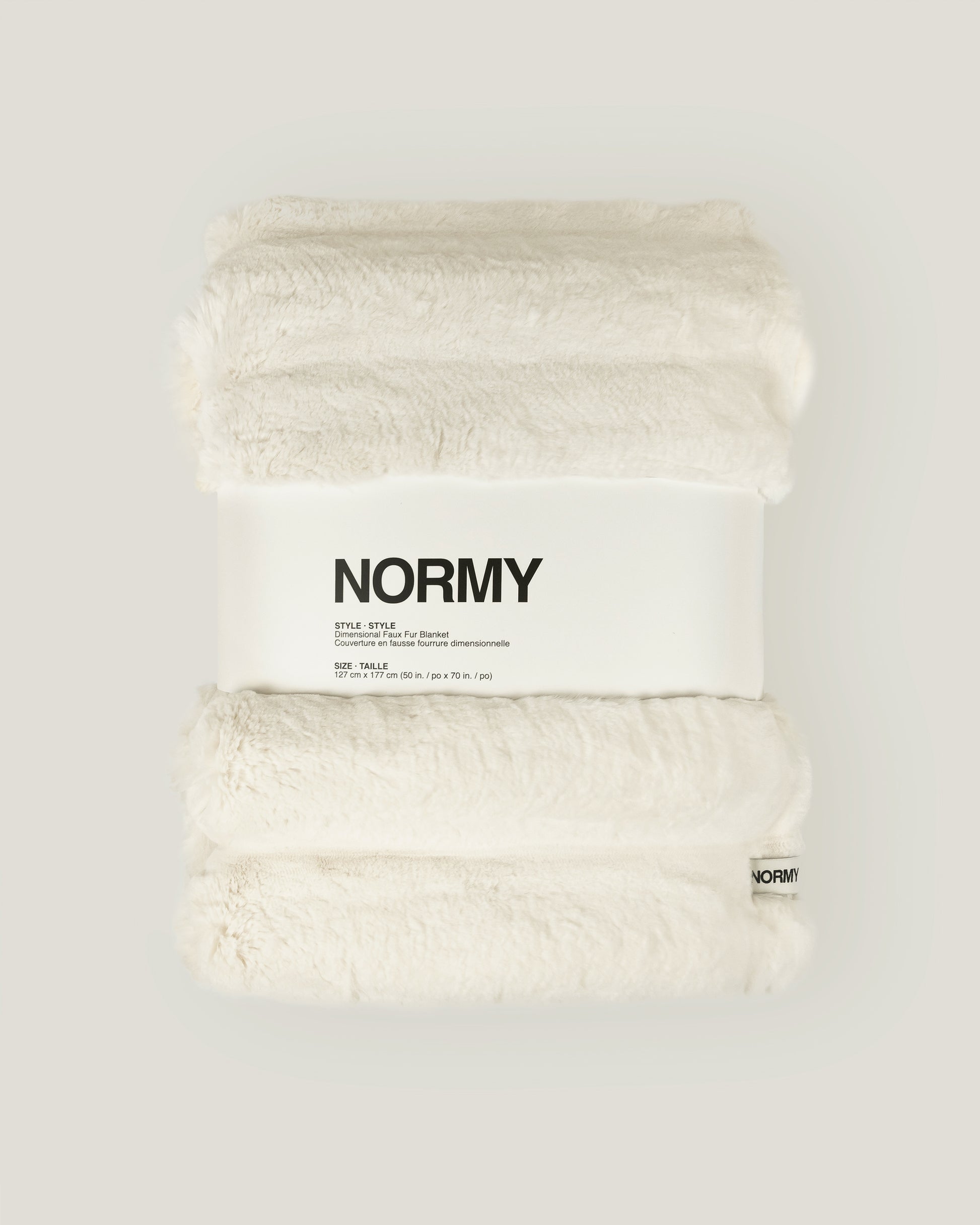 Dimensional faux fur blanket in moon packaged in Normy packaging