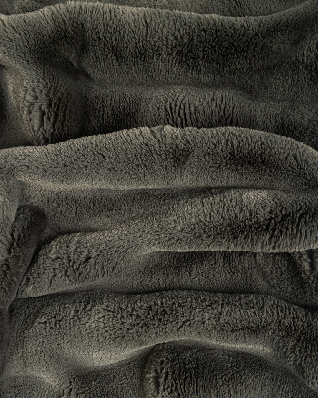 close up fabric shot of a dimensional faux fur blanket in peak