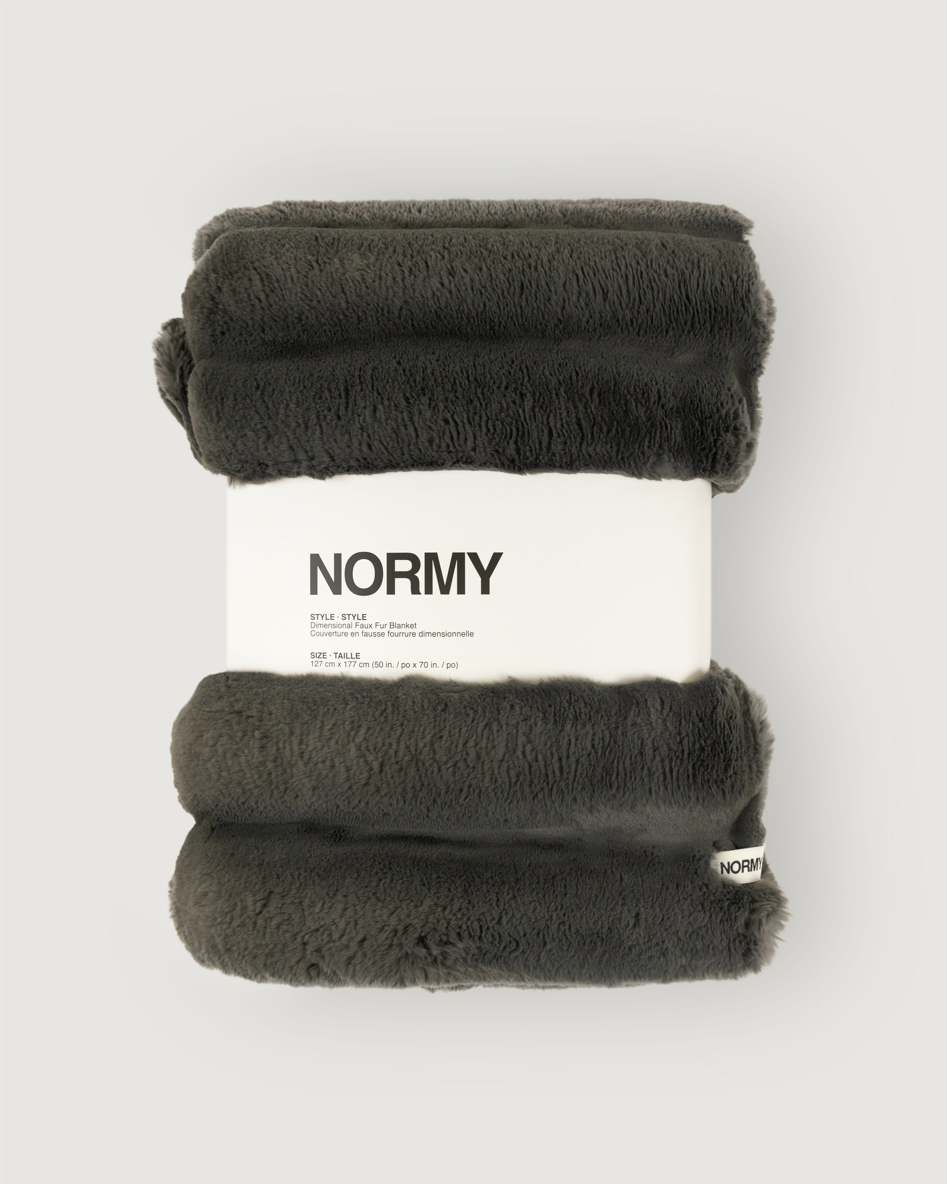 Dimensional faux fur blanket in peak packaged in Normy packaging