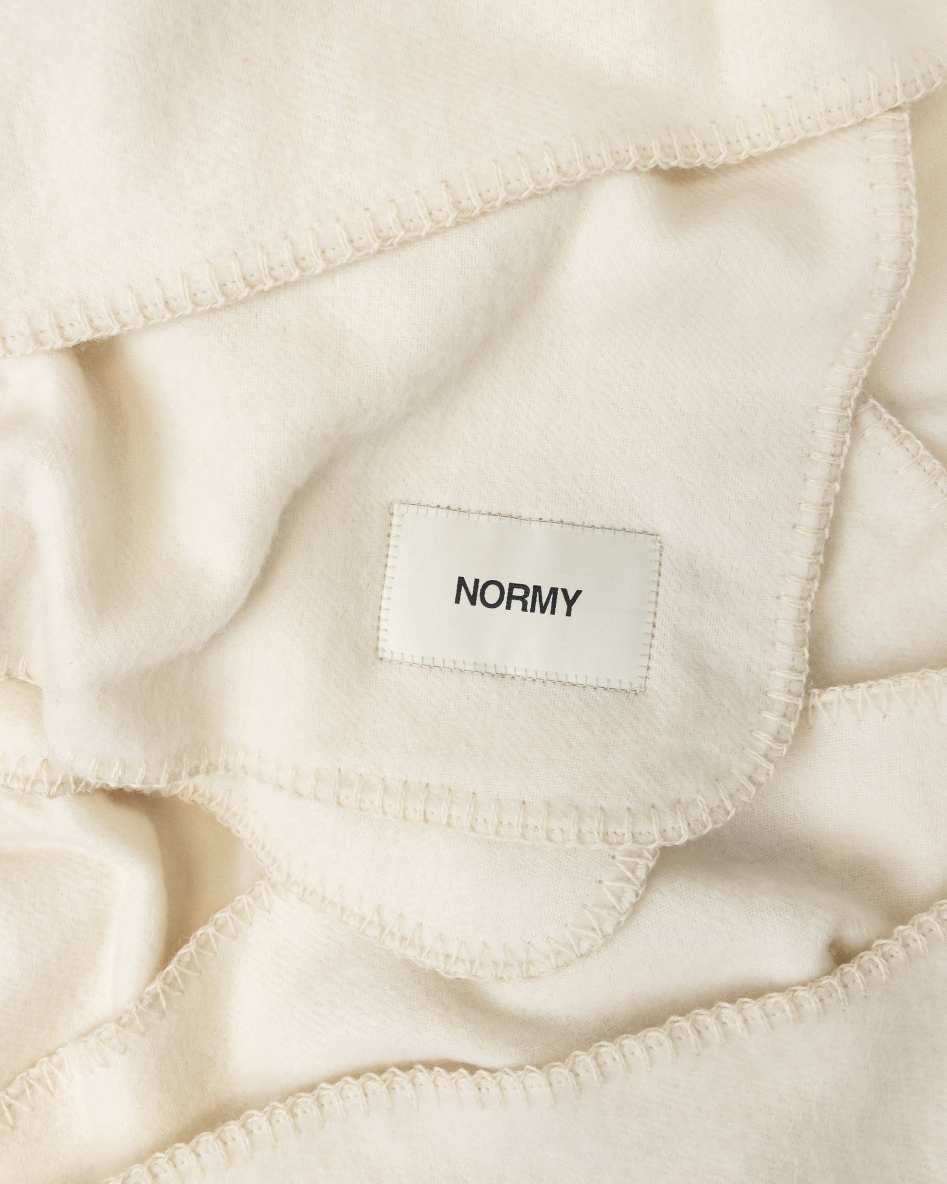 Close up fabric shot of a merino wool blanket in moon